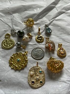 12 assorted charms and pendants. Most new, all mint. Genuine topaz